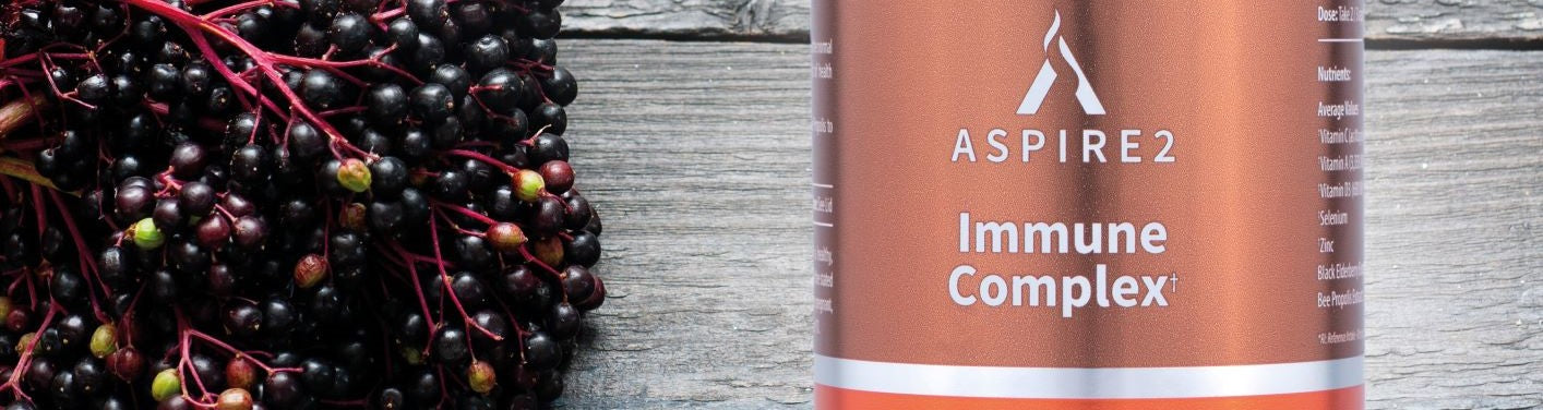Aspire 2 Immune Complex Image showing black elderberry and a bottle of Aspire 2 Immune Complex